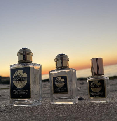 Rain Pure Perfume bottles at sunset